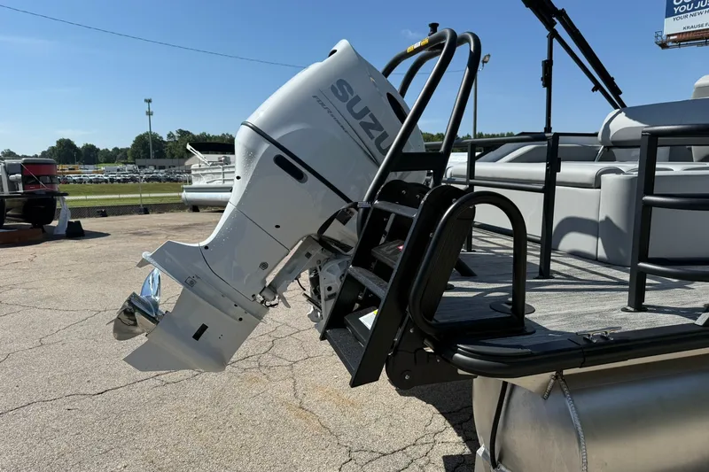 Slide: The Image of 2026 Bentley Pontoons Legacy 223 Swingback with Suzuki outboard motor on display. - 19