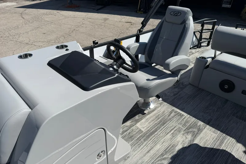 Slide: The Image of 2026 Bentley Pontoons Legacy 223 Swingback helm with modern steering and seating. - 4