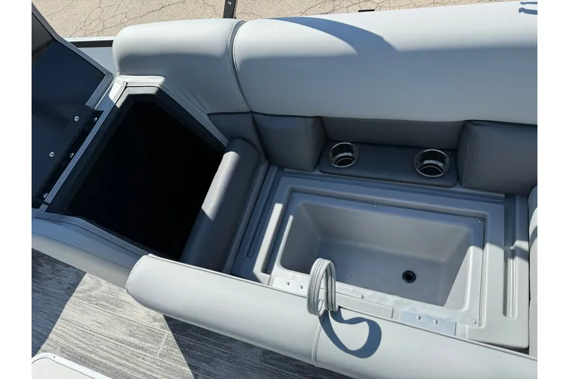 Slide: The Image of 2026 Bentley Pontoons Legacy 223 Swingback interior with storage compartment and cup holders. - 8