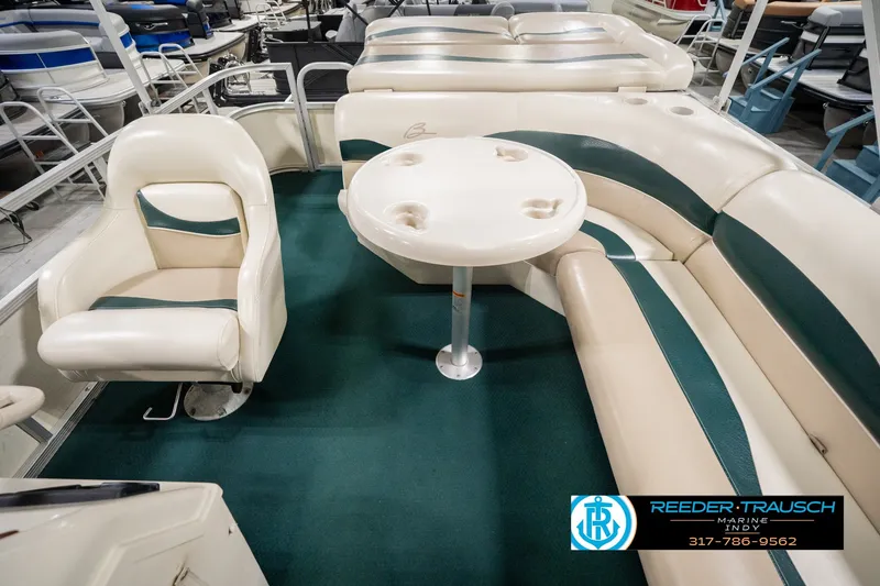 Slide: The Image of Interior of a 2000 Bennington 227L pontoon boat with seating and table. - 21