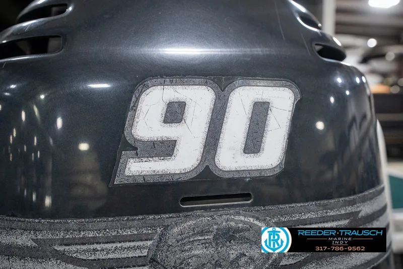 Slide: The Image of Close-up of a Bennington 227L boat engine with "90" decal, year 2000. - 50