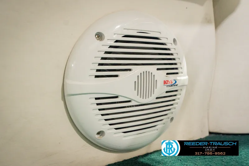 Slide: The Image of White Boss Marine speaker on a 2000 Bennington 227L boat interior. - 46