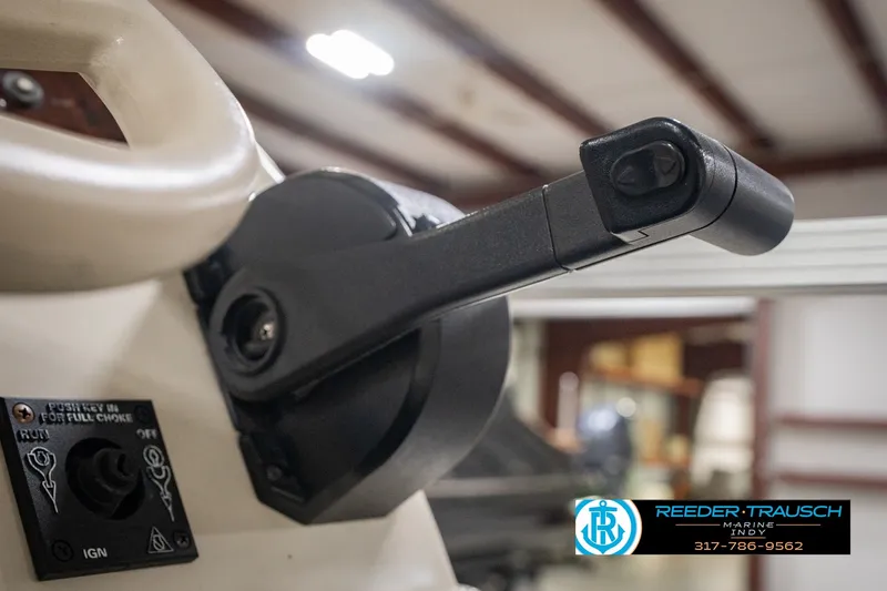Slide: The Image of Close-up of a 2000 Bennington 227L boat throttle control in a showroom. - 40
