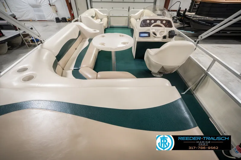 Slide: The Image of Interior of a 2000 Bennington 227L pontoon boat with seating and steering console. - 22