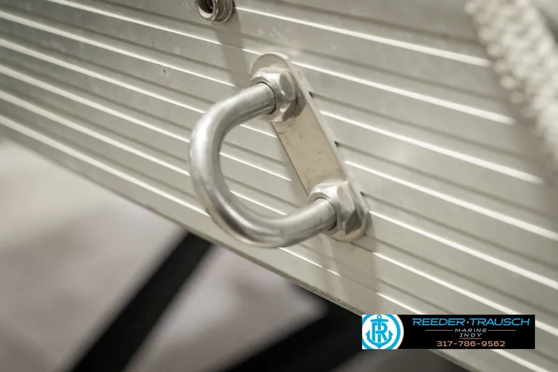 Slide: The Image of Close-up of a metal hook on a 2000 Bennington 227L boat. - 55