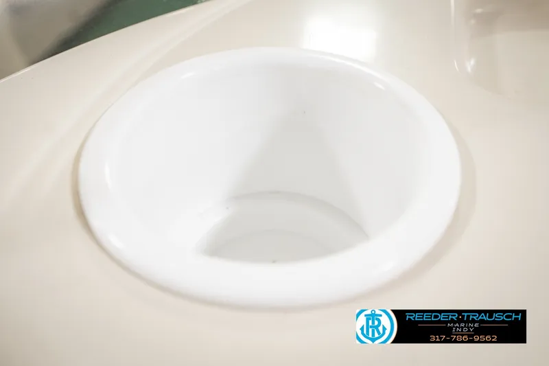 Slide: The Image of Cup holder on a 2000 Bennington 227L boat, Reeder-Trausch Marine logo visible. - 45