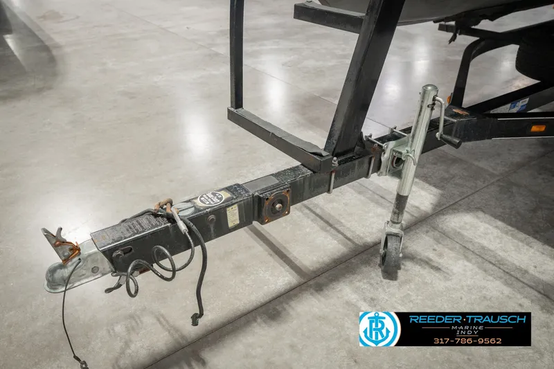 Slide: The Image of Trailer hitch of a 2000 Bennington 227L boat on display indoors. - 57