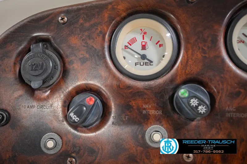 Slide: The Image of Dashboard of a 2000 Bennington 227L boat with fuel gauge and controls. - 37