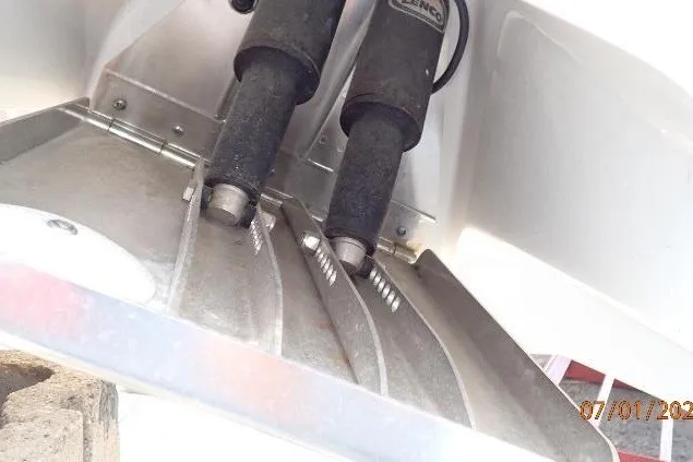 Slide: The Image of 2023 Cape Horn 34XS boat trim tabs and hydraulic system close-up. - 14