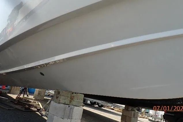 Slide: The Image of 2023 Cape Horn 34XS boat hull on blocks, side view. - 22