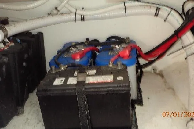 Slide: The Image of Battery compartment of 2023 Cape Horn 34XS boat with wiring and connections. - 55