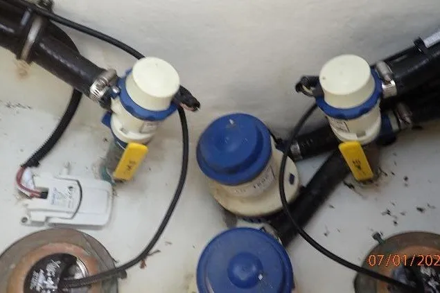Slide: The Image of Boat plumbing system components in a 2023 Cape Horn 34XS, featuring valves and connectors. - 35