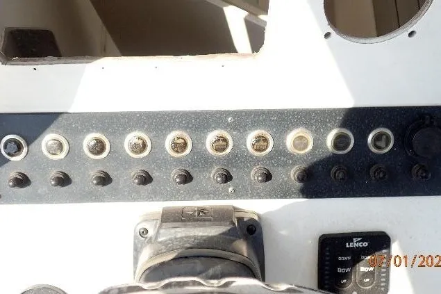 Slide: The Image of Control panel of a 2023 Cape Horn 34XS boat with switches and gauges. - 39