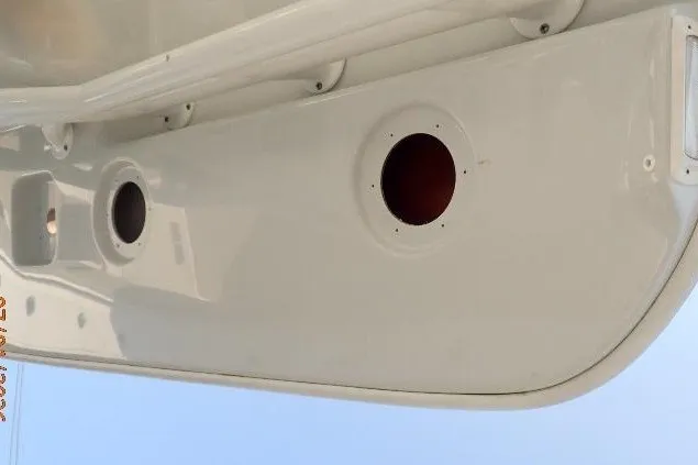 Slide: The Image of 2023 Cape Horn 34XS boat hull with circular openings, viewed from below. - 43