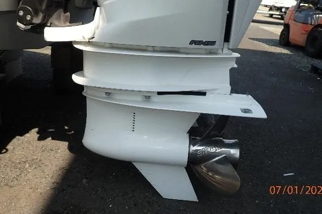 Slide: The Image of 2023 Cape Horn 34XS boat engine close-up, showcasing propeller and lower unit details. - 63