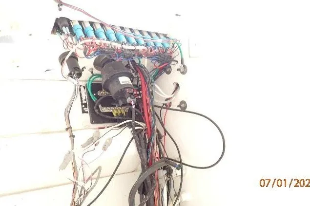 Slide: The Image of Electrical wiring and components inside a 2023 Cape Horn 34XS boat. - 53