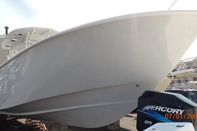 Slide: The Image of 2023 Cape Horn 34XS boat with Mercury EFI engine, docked outdoors. - 20