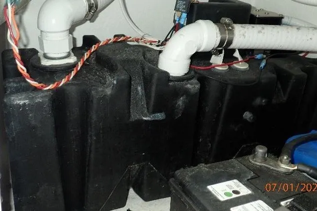 Slide: The Image of 2023 Cape Horn 34XS boat plumbing and battery system close-up. - 56