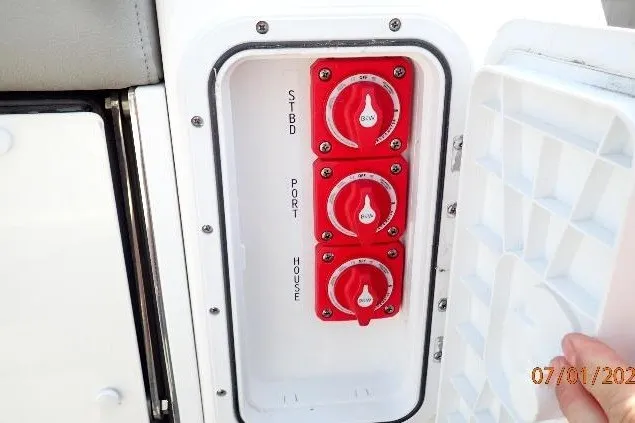 Slide: The Image of Control panel with red switches on a 2023 Cape Horn 34XS boat. - 28