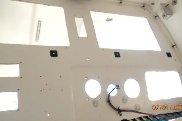 Slide: The Image of Interior view of 2023 Cape Horn 34XS boat, showing wiring and panel cutouts. - 50