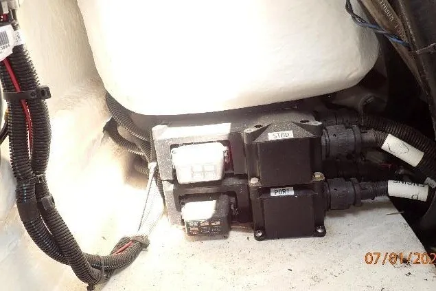 Slide: The Image of Electrical components inside a 2023 Cape Horn 34XS boat, featuring labeled wiring and connectors. - 33
