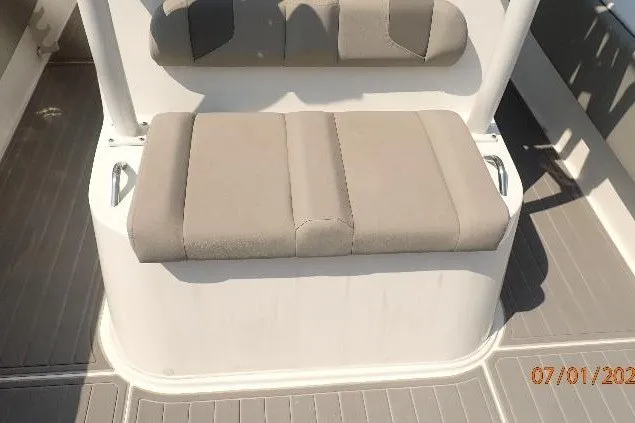 Slide: The Image of 2023 Cape Horn 34XS boat seating area with cushioned bench and backrest. - 36