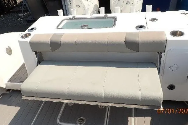 Slide: The Image of 2023 Cape Horn 34XS boat with cushioned seating and integrated storage. - 27