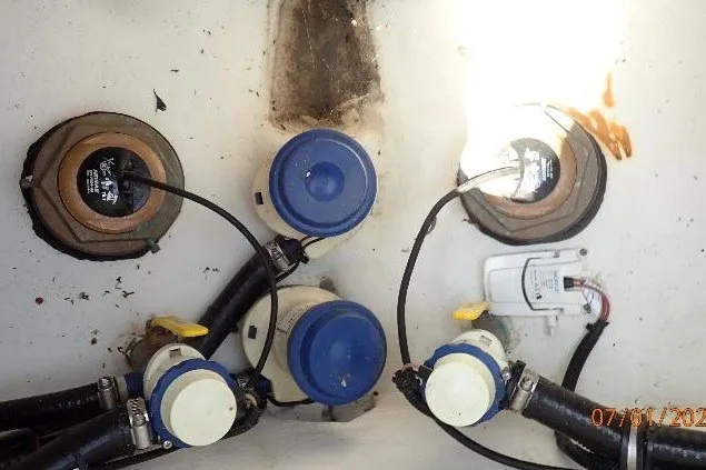 Slide: The Image of Bilge area of 2023 Cape Horn 34XS boat with pumps and wiring. - 34
