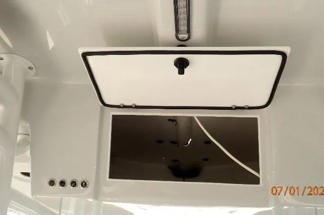 Slide: The Image of 2023 Cape Horn 34XS boat storage compartment with open hatch and visible interior. - 46