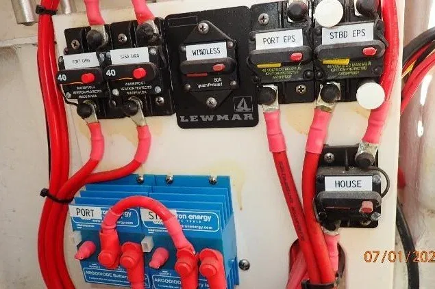 Slide: The Image of Electrical panel of a 2023 Cape Horn 34XS boat with labeled switches and wiring. - 30