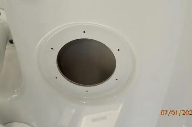 Slide: The Image of 2023 Cape Horn 34XS boat component with circular opening and mounting holes. - 44