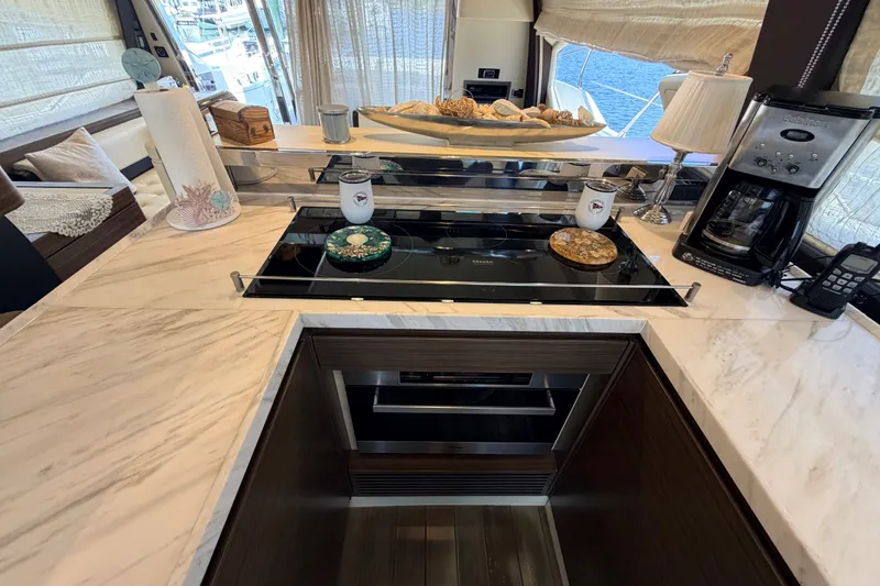 Slide: The Image of Luxurious kitchen interior on a 2014 Azimut 64 yacht with modern appliances. - 19