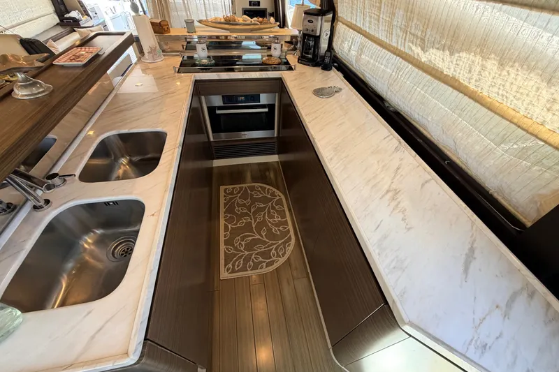 Slide: The Image of Luxurious kitchen interior of a 2014 Azimut 64 yacht with marble countertops. - 18