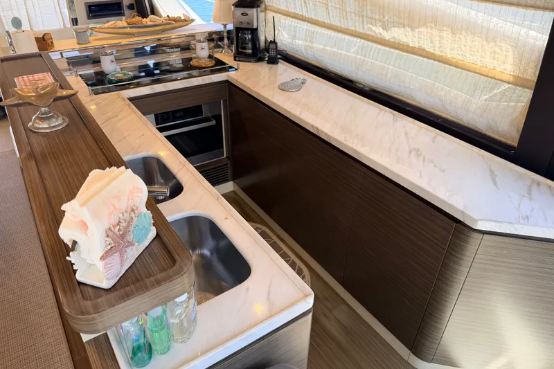 Slide: The Image of Luxurious kitchen interior of 2014 Azimut 64 yacht with marble countertops and modern appliances. - 17