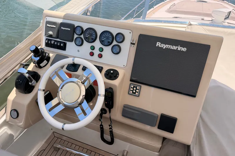 Slide: The Image of Helm of 2014 Azimut 64 yacht with Raymarine navigation system and controls. - 40