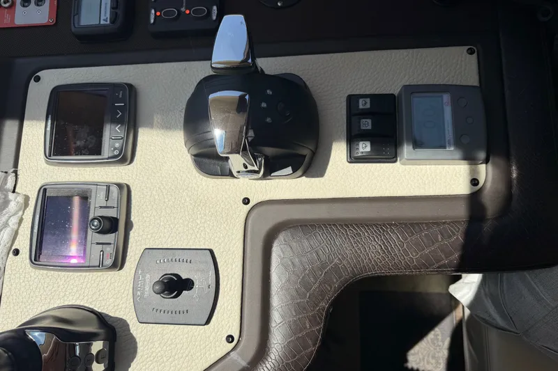 Slide: The Image of Control panel of a 2014 Azimut 64 yacht with various switches and displays. - 30