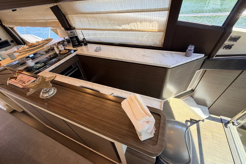 Slide: The Image of Luxurious interior of a 2014 Azimut 64 yacht with modern kitchen amenities. - 16