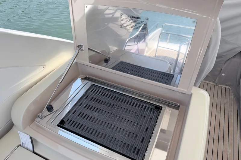 Slide: The Image of Outdoor grill on 2014 Azimut 64 yacht, featuring sleek design and water backdrop. - 42