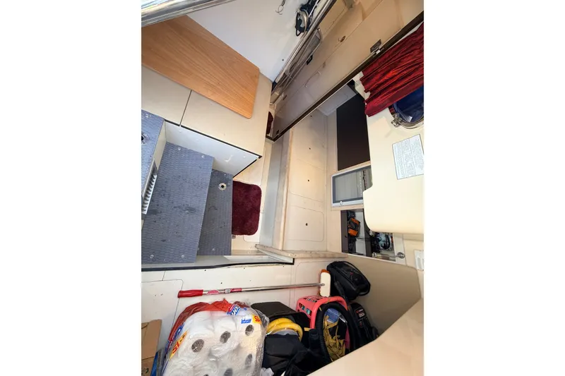 Slide: The Image of Interior view of 2014 Azimut 64 yacht, showing storage area and steps. - 53