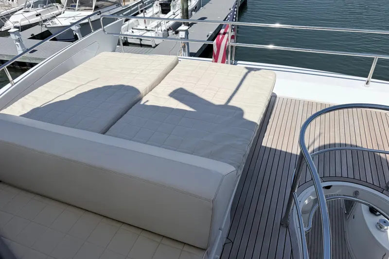 Slide: The Image of Luxurious 2014 Azimut 64 yacht deck with sunbed and elegant railing at marina. - 43