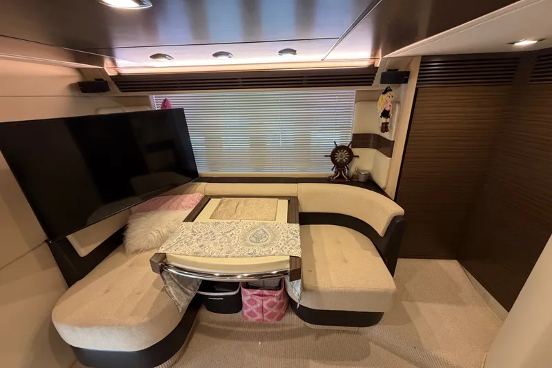 Slide: The Image of Luxurious interior of a 2014 Azimut 64 yacht with plush seating and modern decor. - 34