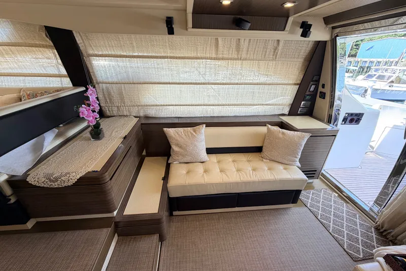 Slide: The Image of Luxurious interior of a 2014 Azimut 64 yacht with elegant seating and decor. - 14