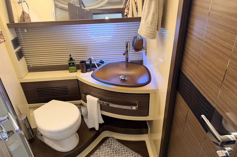 Slide: The Image of Luxurious 2014 Azimut 64 yacht bathroom with modern fixtures and elegant wood accents. - 37