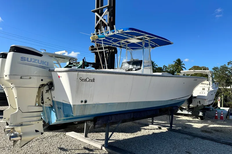 The Image of 2000 SeaCraft SC 32 Master Angler boat with Suzuki engines on a sunny day. - 0