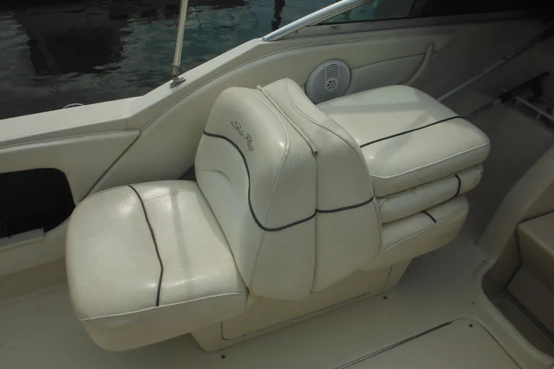 Slide: The Image of 2004 Sea Ray 245 Weekender boat seat with white upholstery and black trim. - 21