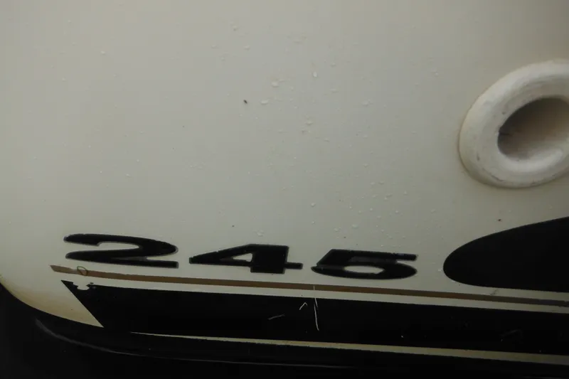 Slide: The Image of Close-up of 2004 Sea Ray 245 Weekender boat hull with model number. - 61