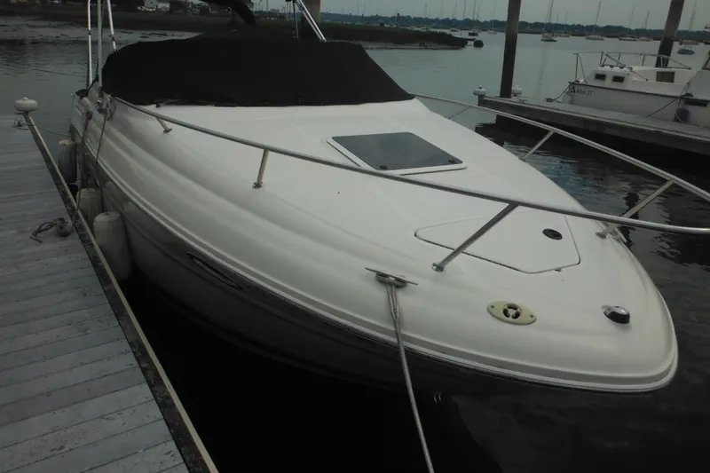 Slide: The Image of 2004 Sea Ray 245 Weekender boat docked at marina. - 14