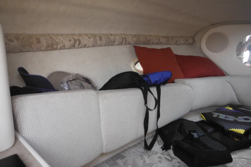 Slide: The Image of Interior cabin of a 2004 Sea Ray 245 Weekender with cushions and gear. - 39