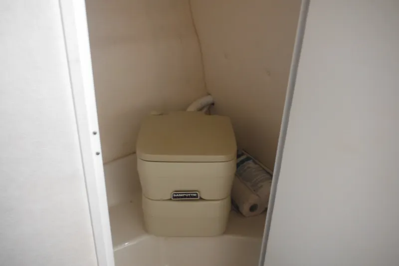 Slide: The Image of Portable toilet inside 2004 Sea Ray 245 Weekender boat cabin. - 49
