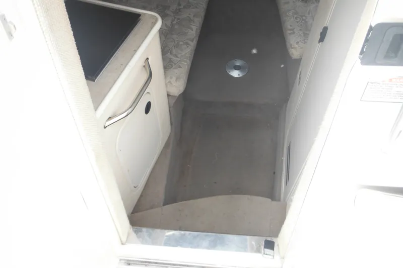 Slide: The Image of Interior cabin view of a 2004 Sea Ray 245 Weekender boat. - 37